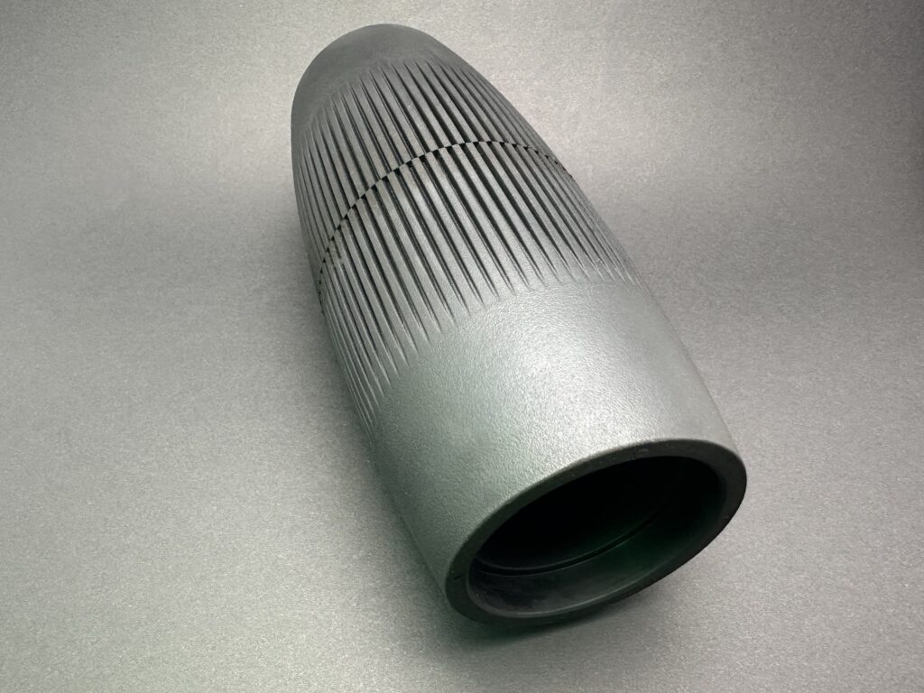 Abgerundete Rolle mit axialer Nutung.
